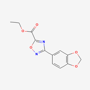 molecular formula C12H10N2O5 B2985498 乙酸-3-(1,3-苯并二噁英-5-基)-1,2,4-噁二唑-5-基甲酯 CAS No. 884982-97-2