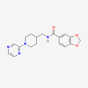 molecular formula C18H20N4O3 B2985503 N-((1-(吡嗪-2-基)哌啶-4-基)甲基)苯并[d][1,3]二氧杂-5-甲酰胺 CAS No. 1396884-46-0
