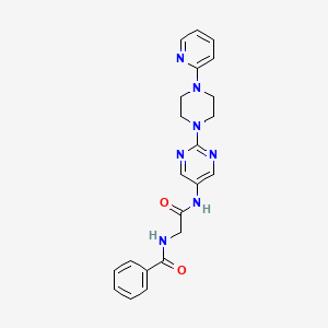 molecular formula C22H23N7O2 B2987284 N-(2-oxo-2-((2-(4-(pyridin-2-yl)piperazin-1-yl)pyrimidin-5-yl)amino)ethyl)benzamide CAS No. 1396812-78-4