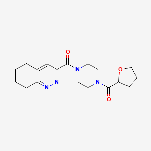 molecular formula C18H24N4O3 B2989573 Oxolan-2-yl-[4-(5,6,7,8-tetrahydrocinnoline-3-carbonyl)piperazin-1-yl]methanone CAS No. 2415565-24-9