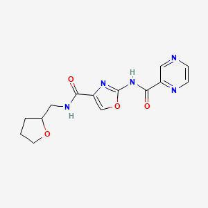 molecular formula C14H15N5O4 B2990333 2-(吡嗪-2-甲酰胺基)-N-((四氢呋喃-2-基)甲基)恶唑-4-甲酰胺 CAS No. 1396815-52-3