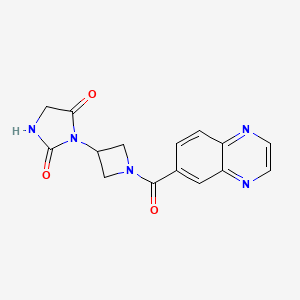 molecular formula C15H13N5O3 B2990768 3-[1-(Quinoxaline-6-carbonyl)azetidin-3-yl]imidazolidine-2,4-dione CAS No. 2034490-06-5