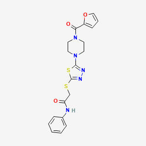 2-((5-(4-(furan-2-carbonyl)piperazin-1-yl)-1,3,4-thiadiazol-2-yl)thio)-N-phenylacetamide
