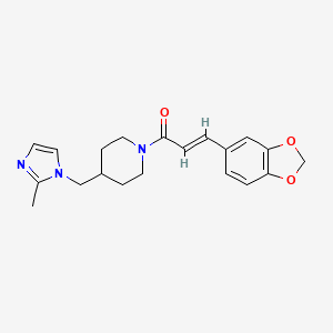 B2998433 (E)-3-(benzo[d][1,3]dioxol-5-yl)-1-(4-((2-methyl-1H-imidazol-1-yl)methyl)piperidin-1-yl)prop-2-en-1-one CAS No. 1286744-45-3