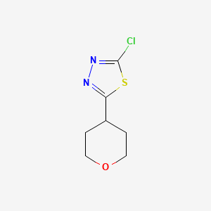 2-Chloro-5-(oxan-4-yl)-1,3,4-thiadiazole