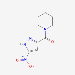 molecular formula C9H12N4O3 B3003066 1-[(3-nitro-1H-pyrazol-5-yl)carbonyl]piperidine CAS No. 1092683-48-1