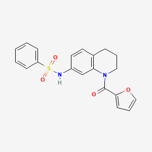 molecular formula C20H18N2O4S B3005061 N-[1-(2-furoyl)-1,2,3,4-tetrahydroquinolin-7-yl]benzenesulfonamide CAS No. 946369-49-9
