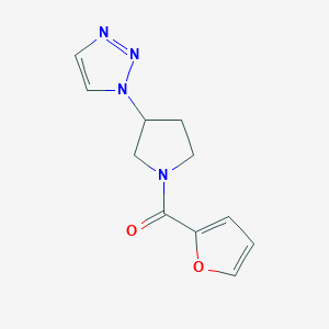 molecular formula C11H12N4O2 B3005561 (3-(1H-1,2,3-triazol-1-yl)pyrrolidin-1-yl)(furan-2-yl)methanone CAS No. 1788557-77-6