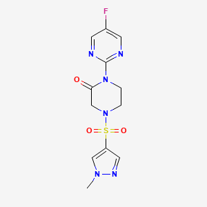molecular formula C12H13FN6O3S B3008506 1-(5-Fluoropyrimidin-2-yl)-4-(1-methylpyrazol-4-yl)sulfonylpiperazin-2-one CAS No. 2320926-35-8