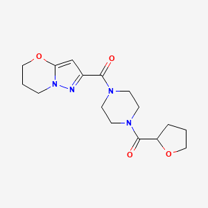 molecular formula C16H22N4O4 B3008516 (6,7-二氢-5H-吡唑并[5,1-b][1,3]恶嗪-2-基)(4-(四氢呋喃-2-羰基)哌嗪-1-基)甲苯酮 CAS No. 1448135-89-4