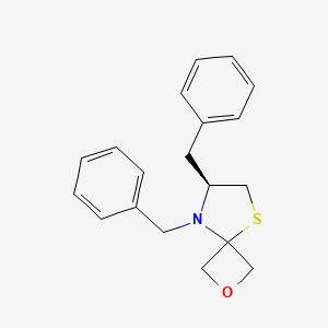 B3011734 (S)-5,6-dibenzyl-2-oxa-8-thia-5-azaspiro[3.4]octane CAS No. 1556097-50-7