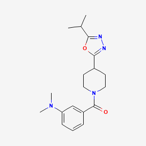 molecular formula C19H26N4O2 B3012361 (3-(Dimethylamino)phenyl)(4-(5-isopropyl-1,3,4-oxadiazol-2-yl)piperidin-1-yl)methanone CAS No. 1210643-00-7