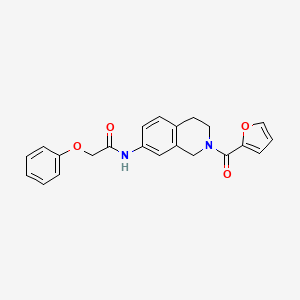 molecular formula C22H20N2O4 B3017230 N-(2-(furan-2-carbonyl)-1,2,3,4-tetrahydroisoquinolin-7-yl)-2-phenoxyacetamide CAS No. 955684-25-0
