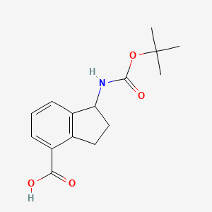 molecular formula C15H19NO4 B3018013 1-[(2-Methylpropan-2-yl)oxycarbonylamino]-2,3-dihydro-1H-indene-4-carboxylic acid CAS No. 1784830-43-8