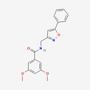 B3018301 3,5-dimethoxy-N-((5-phenylisoxazol-3-yl)methyl)benzamide CAS No. 946340-03-0