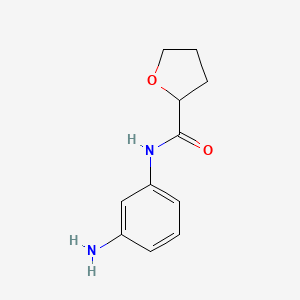 N-(3-aminophenyl)oxolane-2-carboxamide