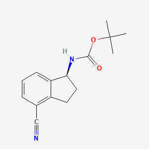tert-butyl N-[(1S)-4-cyano-2,3-dihydro-1H-inden-1-yl]carbamate