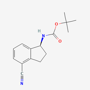 molecular formula C15H18N2O2 B3027513 叔丁基 N-[(1S)-4-氰基-2,3-二氢-1H-茚-1-基]氨基甲酸酯 CAS No. 1306763-31-4