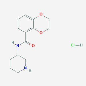 molecular formula C14H19ClN2O3 B3027631 N-(Piperidin-3-yl)-2,3-dihydrobenzo[b][1,4]dioxine-5-carboxamide hydrochloride CAS No. 1353944-80-5