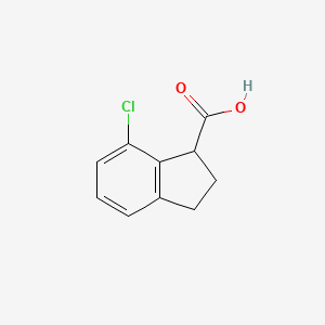 7-Chloro-2,3-dihydro-1H-indene-1-carboxylic acid