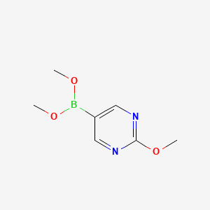 B3039389 Dimethoxy-(2-methoxypyrimidin-5-yl)borane CAS No. 1030288-90-4