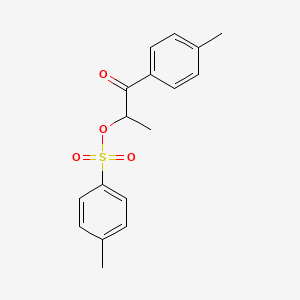 molecular formula C17H18O4S B3045870 1-Propanone, 1-(4-methylphenyl)-2-[[(4-methylphenyl)sulfonyl]oxy]- CAS No. 115424-15-2