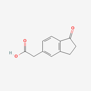 B3046529 2-(1-Oxo-2,3-dihydro-1H-inden-5-yl)acetic acid CAS No. 125564-43-4