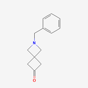 molecular formula C13H15NO B3047263 2-苄基-2-氮杂螺[3.3]庚烷-6-酮 CAS No. 1365639-14-0