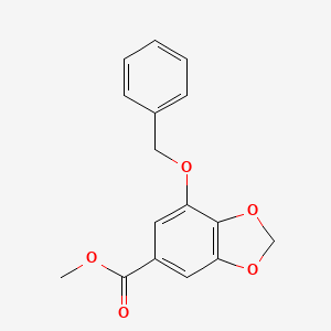 molecular formula C16H14O5 B3047596 1,3-Benzodioxole-5-carboxylic acid, 7-(phenylmethoxy)-, methyl ester CAS No. 142531-43-9