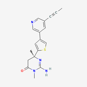 molecular formula C18H18N4OS B3048220 (6S)-2-amino-3,6-dimethyl-6-[4-(5-prop-1-ynylpyridin-3-yl)thiophen-2-yl]-5H-pyrimidin-4-one CAS No. 1613380-81-6