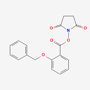 molecular formula C18H15NO5 B3050796 1-{[2-(Benzyloxy)benzoyl]oxy}pyrrolidine-2,5-dione CAS No. 287971-19-1