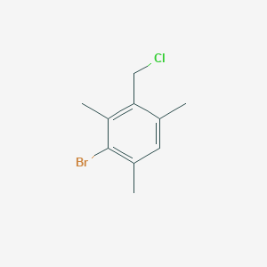 B3056315 2-Bromo-4-(chloromethyl)-1,3,5-trimethylbenzene CAS No. 70335-40-9