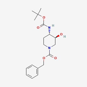 molecular formula C18H26N2O5 B3056571 苯甲酸苄酯反式-4-((叔丁氧羰基)氨基)-3-羟基哌啶-1-甲酸酯 CAS No. 724787-54-6