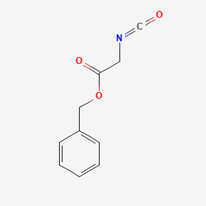 molecular formula C10H9NO3 B3057112 Acetic acid, isocyanato-, phenylmethyl ester CAS No. 76692-58-5
