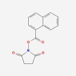 molecular formula C15H11NO4 B3064593 2,5-Pyrrolidinedione, 1-[(1-naphthalenylcarbonyl)oxy]- CAS No. 134676-06-5