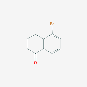 molecular formula C10H9BrO B030818 5-溴-1-茚满酮 CAS No. 68449-30-9