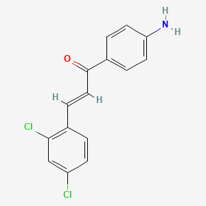 molecular formula C15H11Cl2NO B3089029 (2E)-1-(4-aminophenyl)-3-(2,4-dichlorophenyl)prop-2-en-1-one CAS No. 1188369-64-3