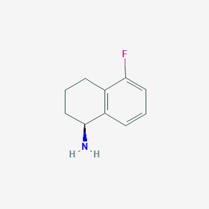 molecular formula C10H12FN B3090650 (1S)-5-Fluoro-1,2,3,4-tetrahydronaphthylamine CAS No. 1212972-62-7