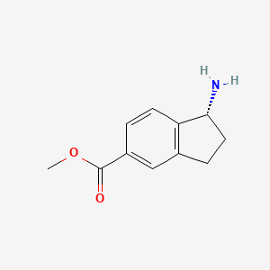 molecular formula C11H13NO2 B3090759 (R)-1-氨基-2,3-二氢-1H-茚满-5-甲酸甲酯 CAS No. 1213609-13-2