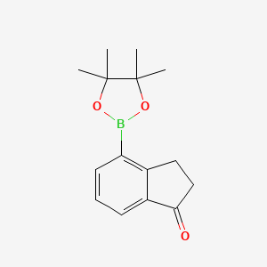 molecular formula C15H19BO3 B3091967 4-(4,4,5,5-tetramethyl-1,3,2-dioxaborolan-2-yl)-2,3-dihydro-1H-inden-1-one CAS No. 1221239-08-2