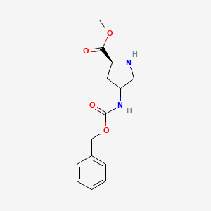 molecular formula C14H18N2O4 B3096289 (2S)-甲基 4-(((苄氧羰基)氨基)吡咯烷-2-羧酸盐 CAS No. 1279026-84-4