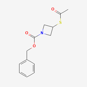 molecular formula C13H15NO3S B3096390 苯甲基-3-乙酰基硫代氮杂环丁烷-1-甲酸酯 CAS No. 128117-23-7