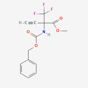 molecular formula C14H12F3NO4 B3096845 Methyl 2-{[(benzyloxy)carbonyl]amino}-2-(trifluoromethyl)but-3-ynoate CAS No. 128970-29-6