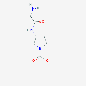 molecular formula C11H21N3O3 B3099373 3-(2-Amino-acetylamino)-pyrrolidine-1-carboxylic acid tert-butyl ester CAS No. 1353960-31-2