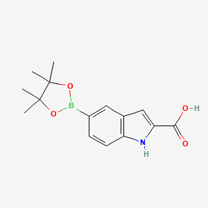 molecular formula C15H18BNO4 B3102029 5-(四甲基-1,3,2-二氧杂硼环-2-基)-1H-吲哚-2-羧酸 CAS No. 1411992-57-8