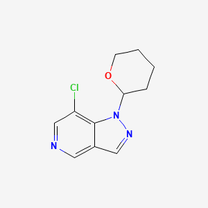molecular formula C11H12ClN3O B3102304 7-Chloro-1-(tetrahydro-2H-pyran-2-yl)-1H-pyrazolo[4,3-c]pyridine CAS No. 1416712-49-6