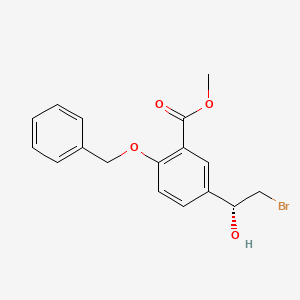 molecular formula C17H17BrO4 B3106865 (R)-Methyl 2-(benzyloxy)-5-(2-bromo-1-hydroxyethyl)benzoate CAS No. 160889-18-9