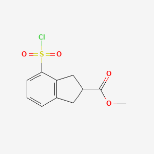 molecular formula C11H11ClO4S B3195188 methyl 4-(chlorosulfonyl)-2,3-dihydro-1H-indene-2-carboxylate CAS No. 888327-29-5