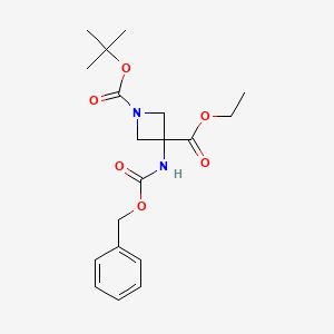 molecular formula C19H26N2O6 B3198301 1-Tert-butyl 3-ethyl 3-(((benzyloxy)carbonyl)amino)azetidine-1,3-dicarboxylate CAS No. 1011479-73-4
