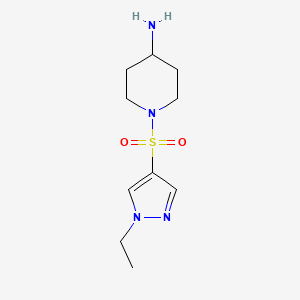 molecular formula C10H18N4O2S B3200683 1-[(1-乙基-1H-吡唑-4-基)磺酰基]哌啶-4-胺 CAS No. 1019006-27-9